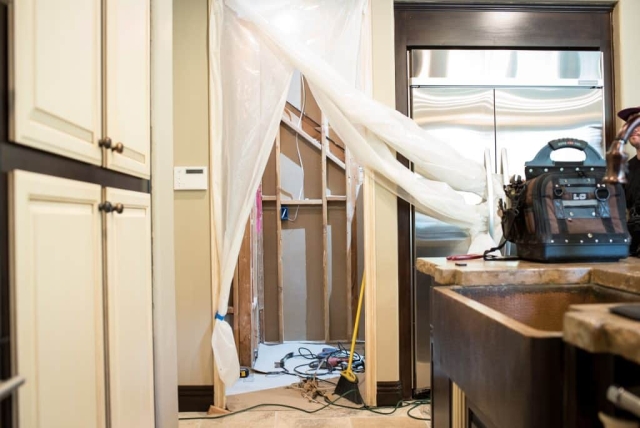 We had to replace the original drywall with a new one after we converted this pantry into a wine cellar then planned the installation of the quiet refrigeration unit,