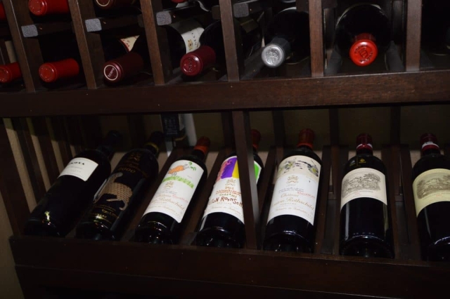 The design of the wooden racking system for this custom wine cellar project in Corona, California maximizes the storage capacity of their wine cellar .