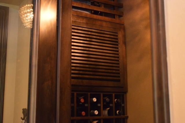 The smart placement of the cooling unit behind the wine racks help in maintaining a quiet wine cellar environment.