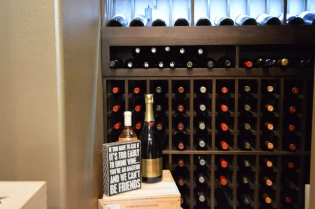 This modern wine cellar boasts a quiet industrial cooling unit with 1/4 horsepower.