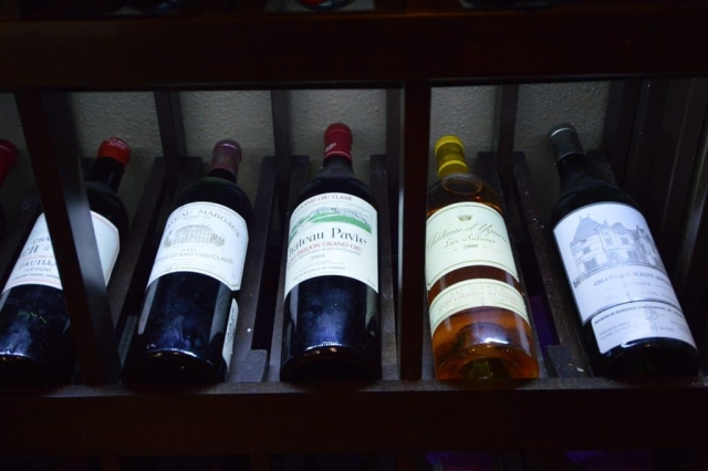 The wooden wine cellar racking system and quiet cooling system is a good conversation piece for the guests.